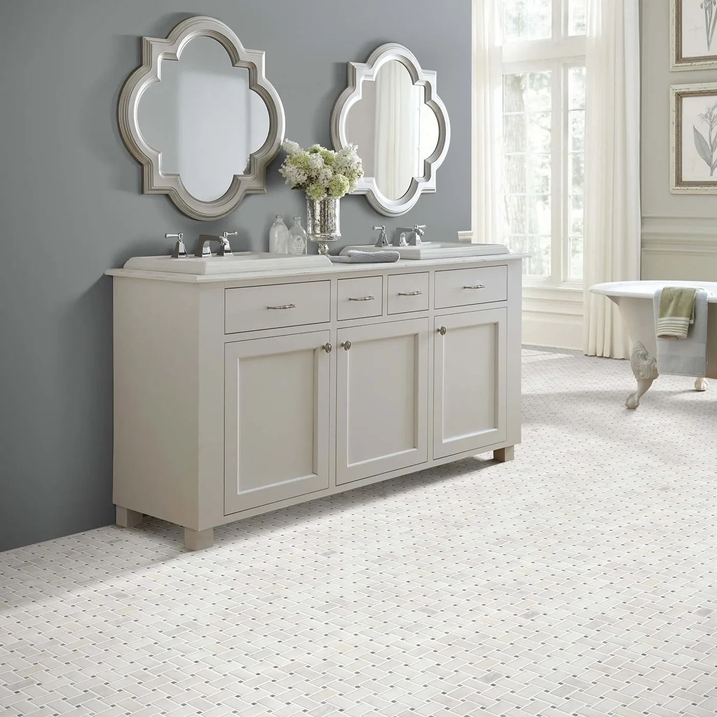 Boca-BasketweavePolishedMos-CS82M-00105-Channel-V Shaw Floors Channel white basketweave mosaic tile in a bathroom with a light gray wall and a white vanity.